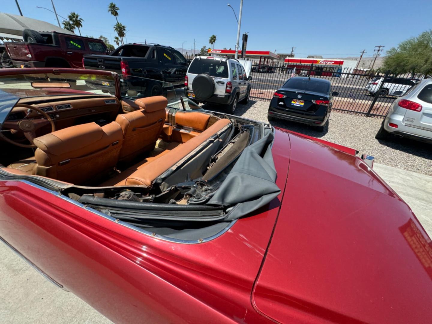 1975 Red Cadillac Eldorado convertible. , located at 2190 Hwy 95, Bullhead City, AZ, 86442, (928) 704-0060, 0.000000, 0.000000 - 1975 Cadillac Eldorado Convertible. Great project car for someone. New tires. Runs and drives, power top works. has a/c doesn't work. needs restoration. interior needs work, engine needs to be serviced . clear title. - Photo#3